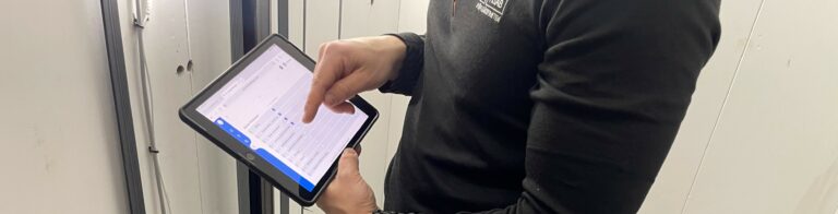 An inspector from Hissbesiktning with an iPad running software developed by Gislen Software as part of the migration from Microsoft Access to the web.